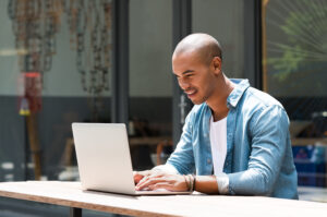 man working on laptop PCL85AU