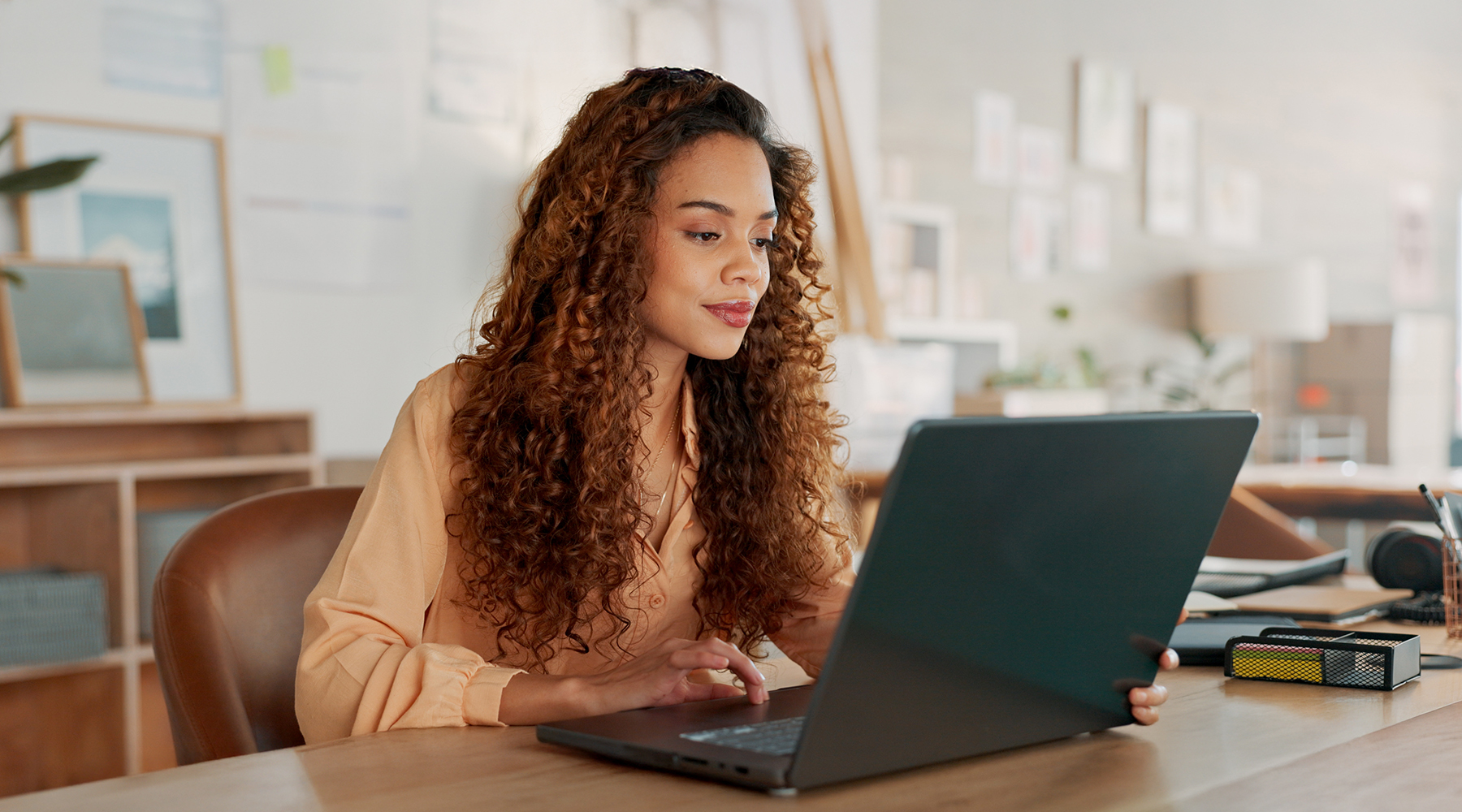 Black woman working on laptop